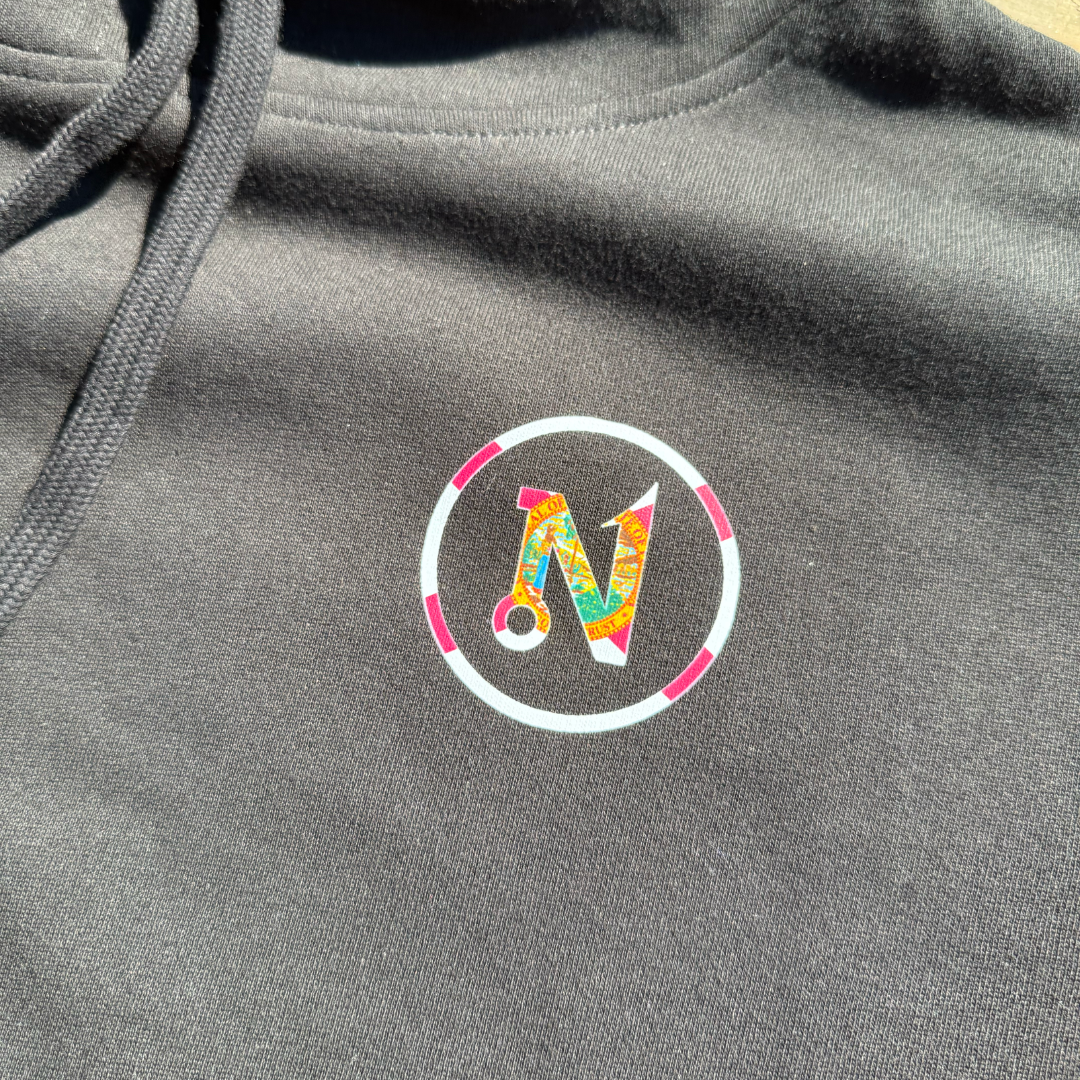 Close up image of front florida themed nautix logo on black hoodie