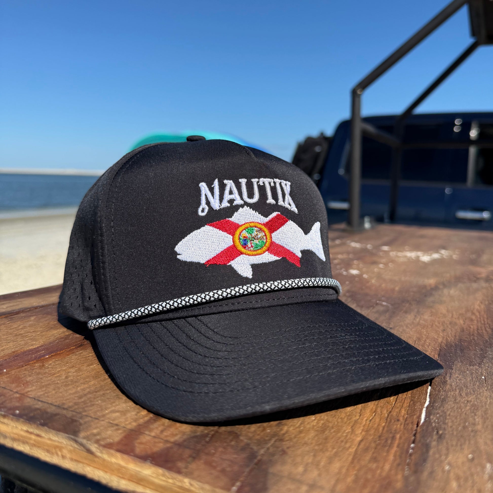 Close-up of mesh back and stitching on black Saltstate snapback hat