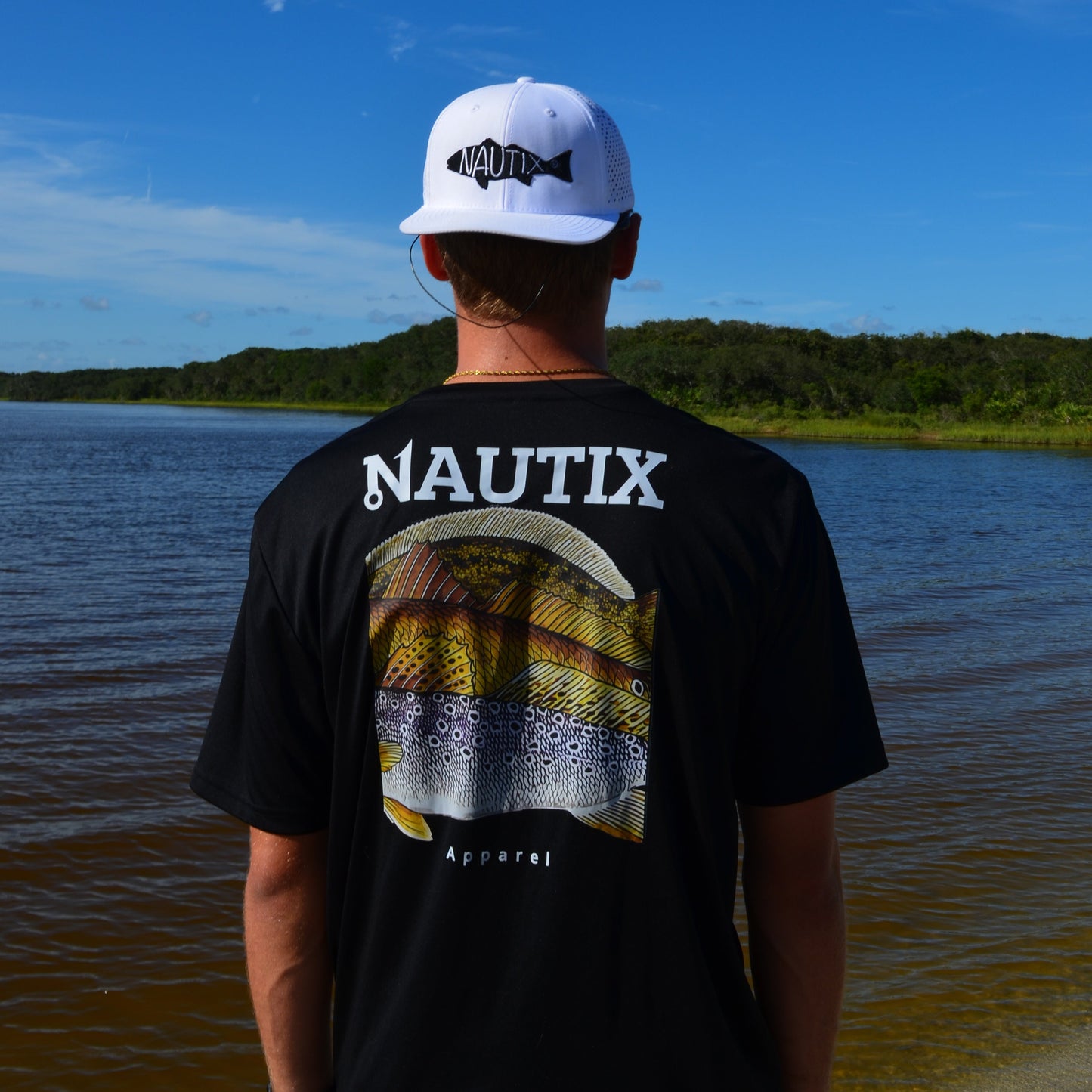 Model wearing black Slam Art tee with large slam fish graphic on back